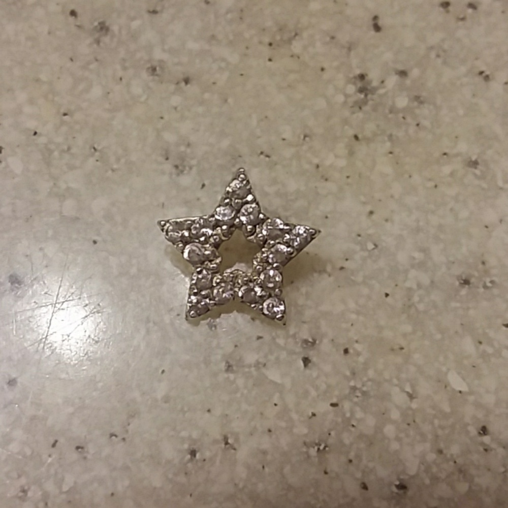 Tiny sterling silver star charm